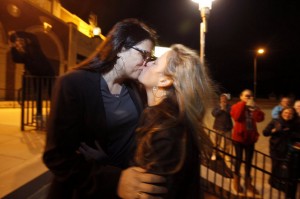 Kissing Brides, Heather Jensen and Amy Quinn, an Asbury Park Councilwoman, celebrate their marriage shortly after midnight on October 21. facebook photo