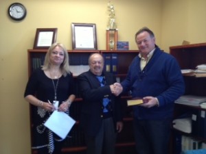Warren Chamberlain, center, takes the oath of office as a Keyport Councilman. Borough Clerk Valerie Valerie Heilweil, left, and Keyport GOP Chairman Bob Burlew, right.