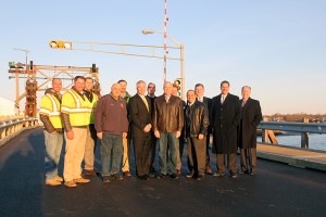 Pictured left to right: Kevin Harms, Rob Harms and Jeff Brantly (all from Harms Construction Company, Inc.), Manasquan Mayor George Dempsey, Dan Healey (from Harms Construction Company, Inc.), Assemblyman David P. Rible, Manasquan Councilman Jeff Lee (in sunglasses), Freeholder Director Gary J. Rich, Sr., Manasquan Councilman Gregg Olivera (partially obscured), Freeholder Thomas A. Arnone, Manasquan Councilman Owen McCarthy, County Public Works Director John W. Tobia and County Engineer Joseph Ettore.